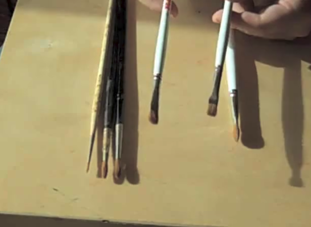 paint brushes over a palette box
