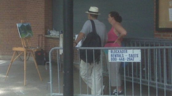 An oil painting lesson being given outside