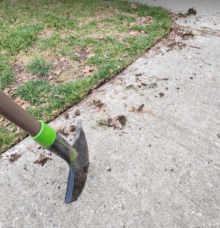 edging a lawn with a half moon edger