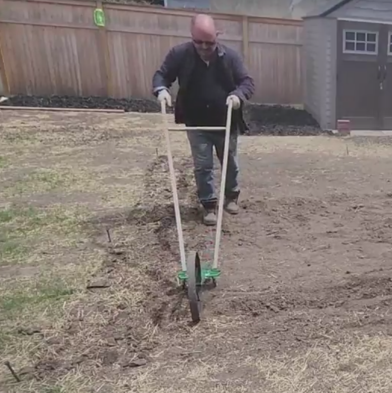 me using the wheel hoe 1